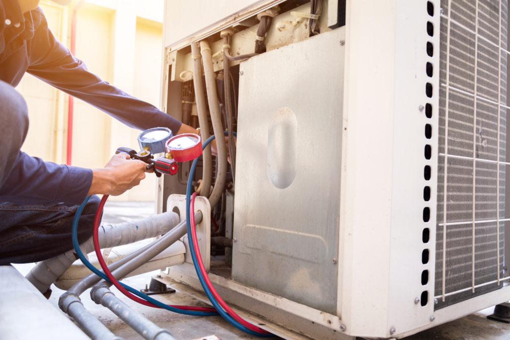 Technician is checking air conditione